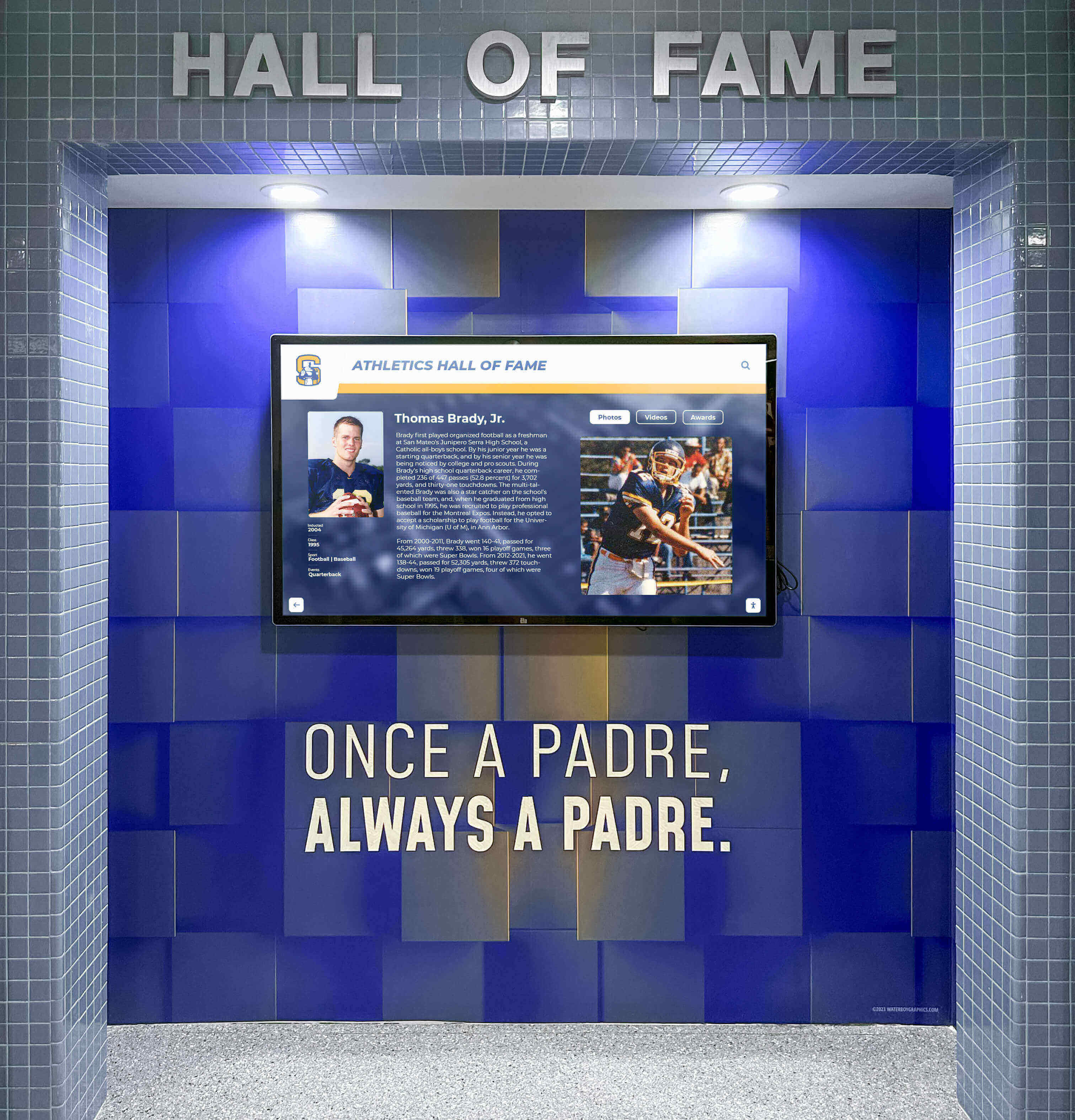 Digital hall of fame screen mounted on school wall showing athletic achievements Athletic hall of fame wall display