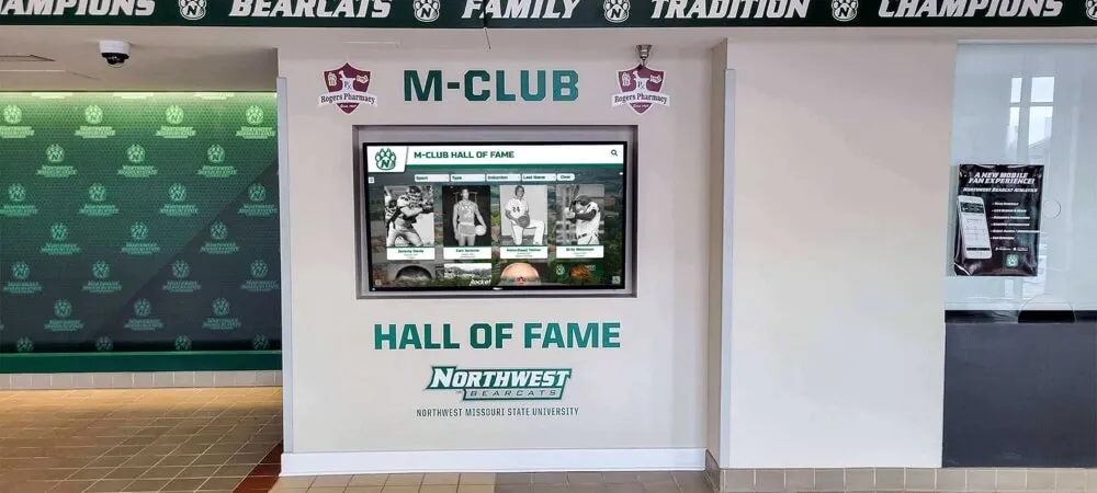 Large-format digital recognition display featuring donor acknowledgment and institutional branding Digital donor recognition display in college lobby