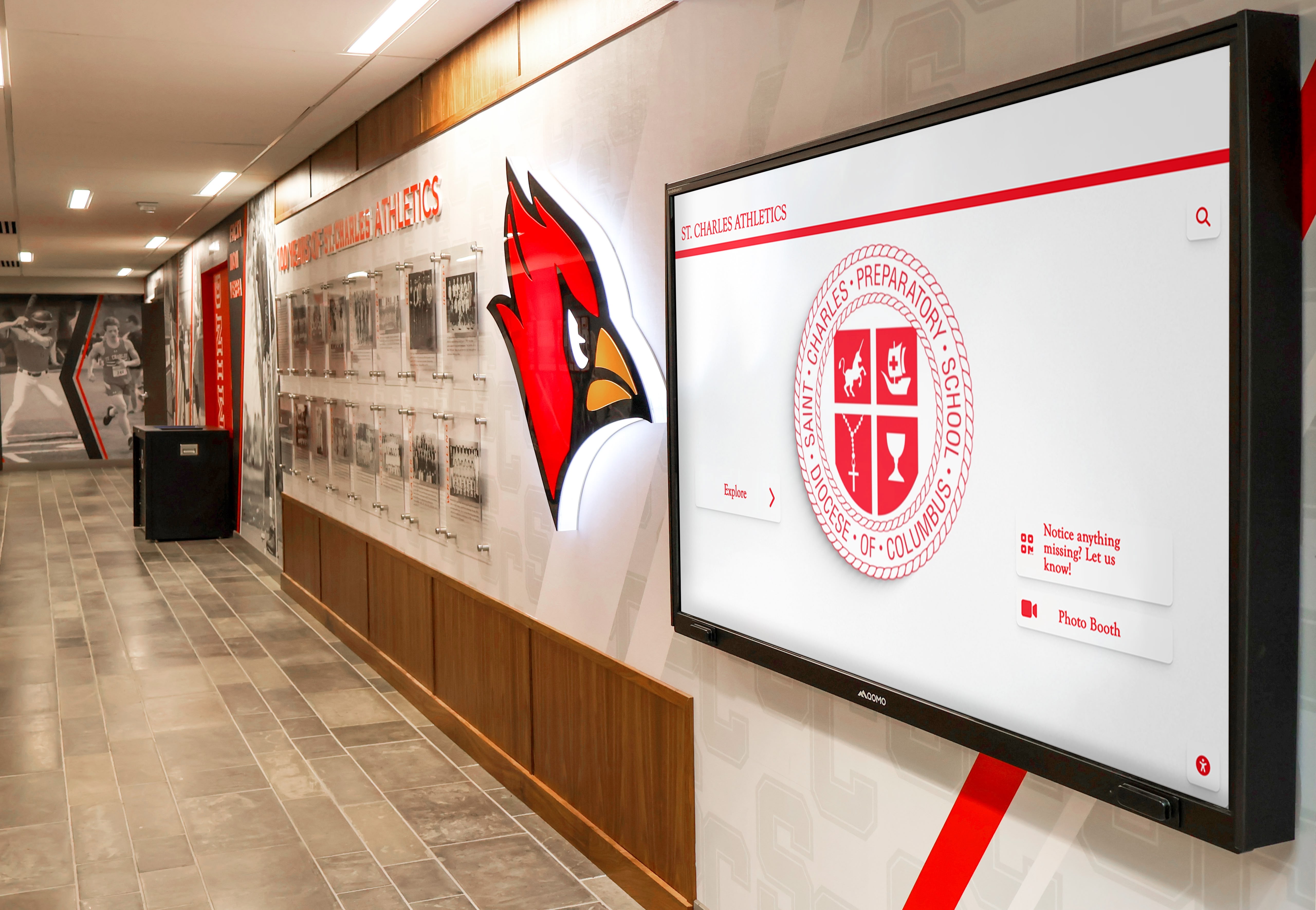 Digital display integrated into athletic facility hallway design Athletic hallway display installation