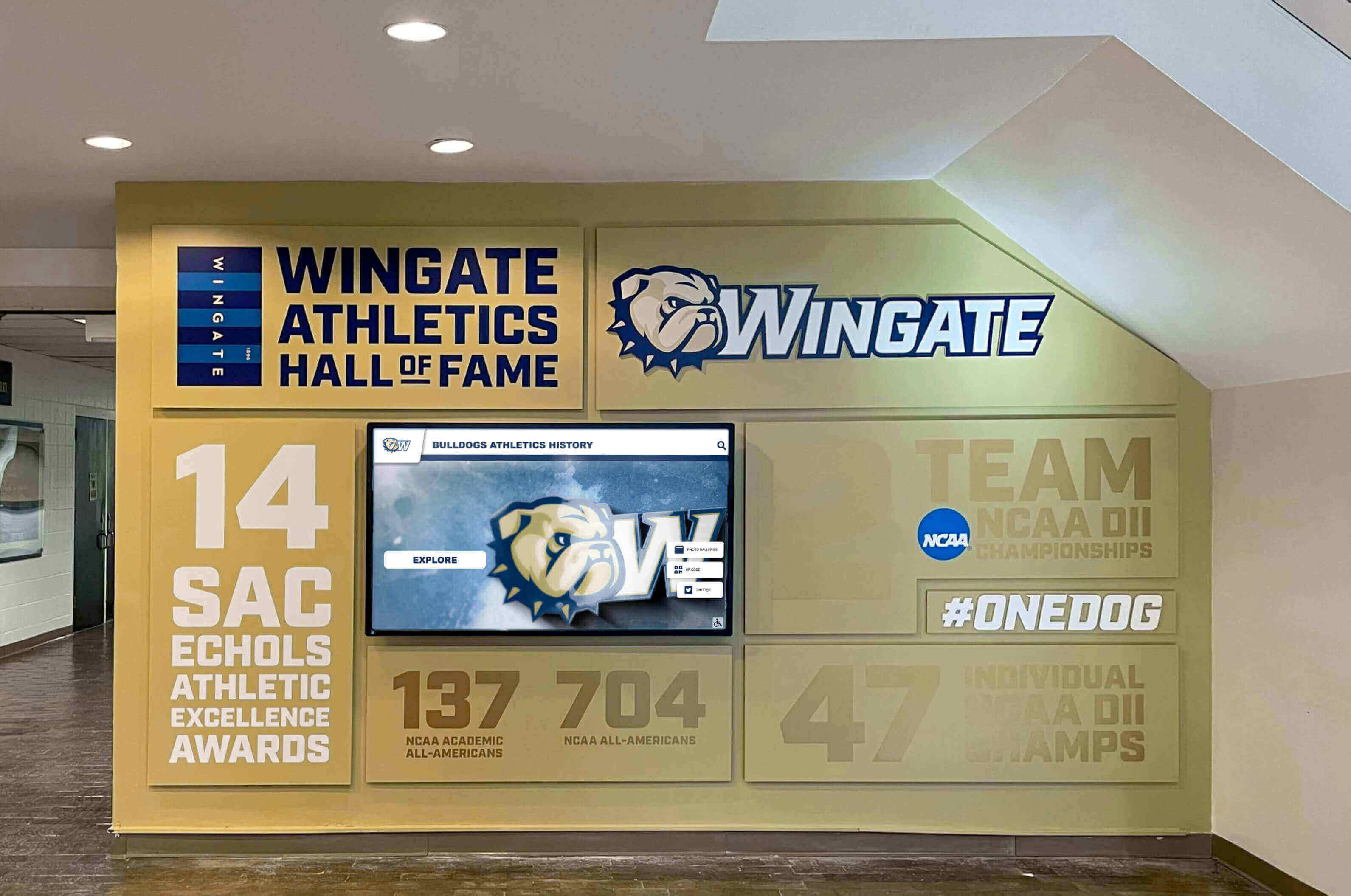 Athletic hall of fame lobby display demonstrating effective entrance placement for booster recognition Wingate Athletics hall of fame lobby bulldog display showing entrance placement strategy